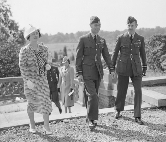 King George VI and Queen Elizabeth, escorted by Air Chief Marshal Sir Hugh Dowding, Air Officer Commander-in-Chief of Fighter Command, visit the Headquarters of Fighter Command at Bentley Priory, near Stanmore, Middlesex, in September 1940. Photo: © IWM