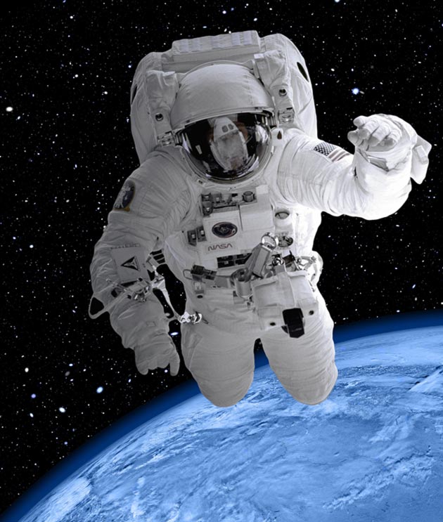 A space suited astronaut above the planet earth 