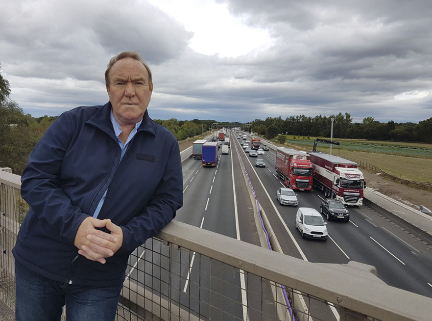 MIKE BROOKER stands above Junction 18 on the M6. Statistically, the motorway is one of the worst accident black spots in the country.